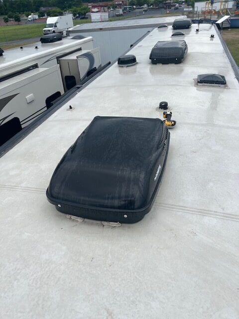 A black bag sitting on top of a white surface.