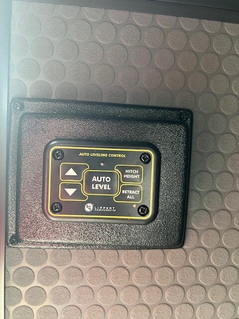 A black and gold control panel on the side of a car.